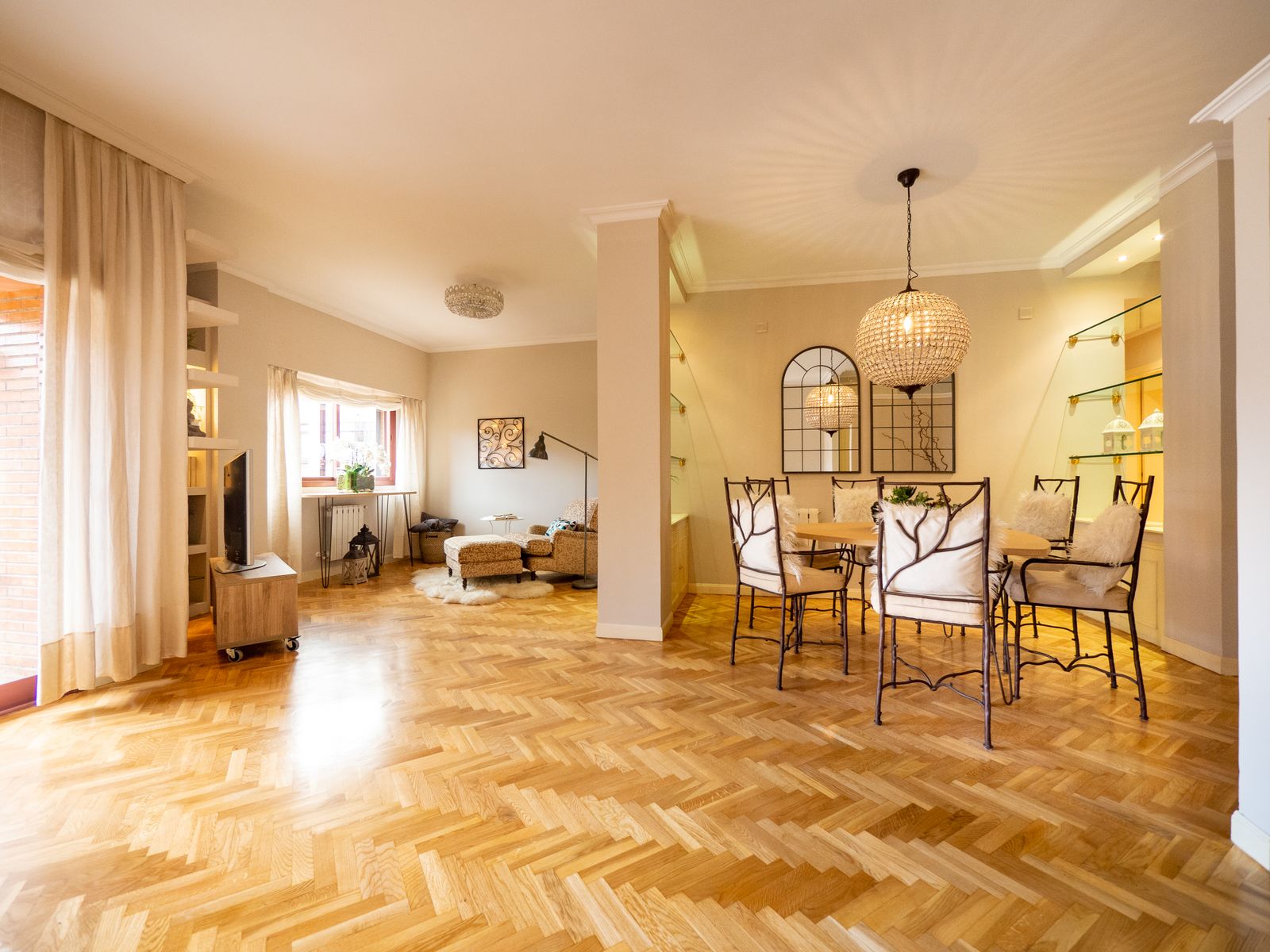 Herringbone oak flooring in a bright reception room