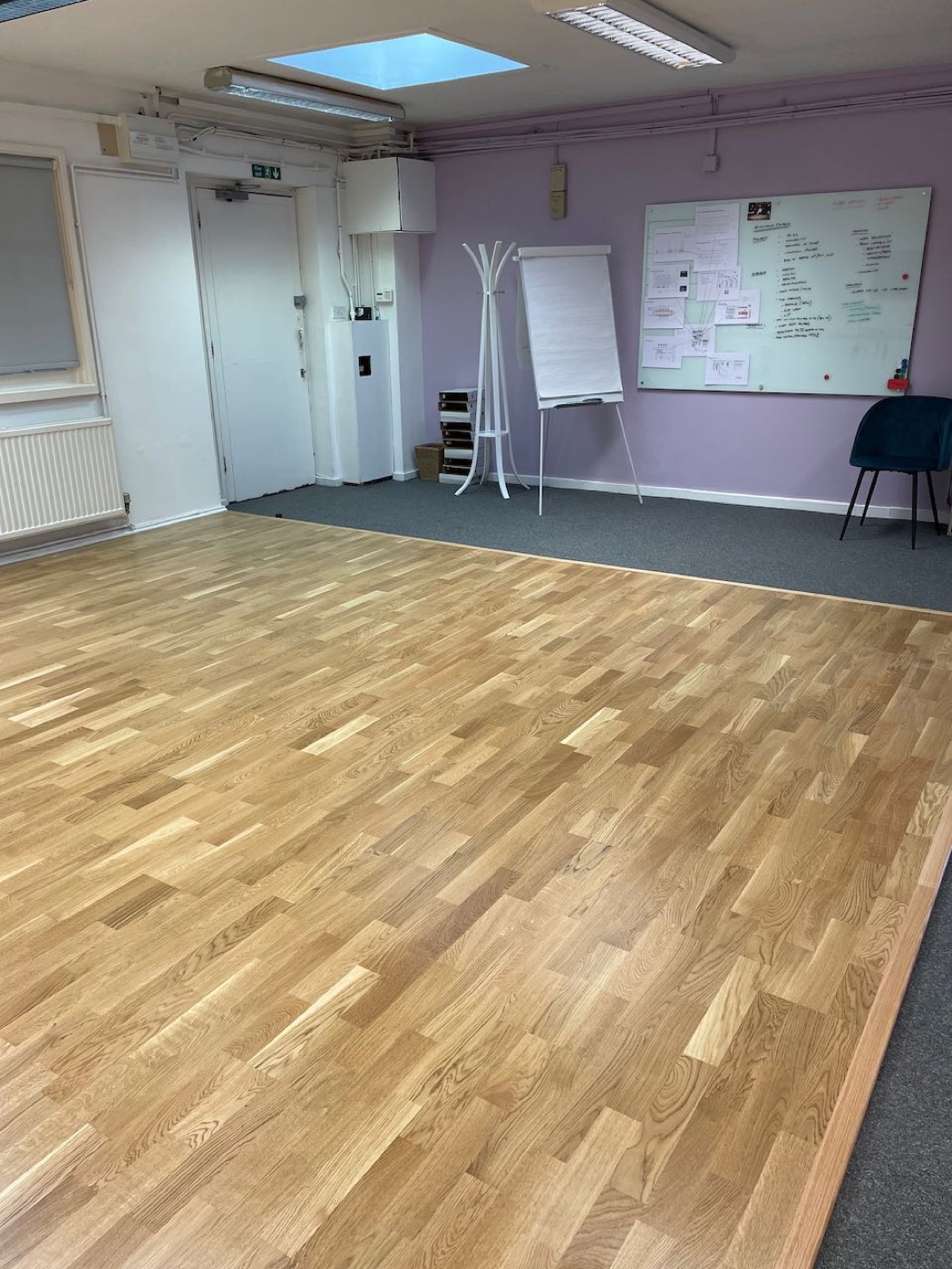 Engineered oak laid across a studio space — a warm, hardwearing floor for a room that gets used.